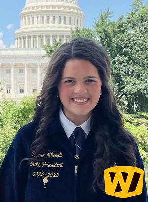 FFA Officer with Dark Hair in Blue FFA Jacket and Official Dress